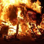 Wildfire Survivors Stuck in Claims Nightmare A large fire engulfing debris at night