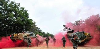 COLOSSAL Baltic Fortification — Russia Beware! Soldiers running from armored vehicles with red smoke.