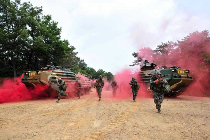 1115301113 Soldiers running from armored vehicles with red smoke.