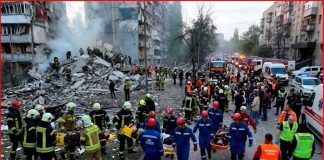 Russia’s Deadly Assault: Kyiv Tower Crumbles Rescuers search for people under the rubble after Russian attack in Kyiv