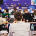 View of a conference room filled with attendees focused on their laptops
