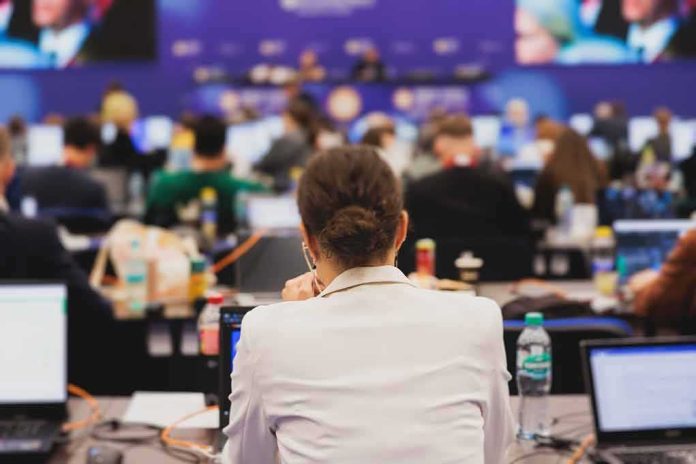 View of a conference room filled with attendees focused on their laptops