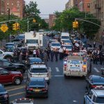 Penn Station Bloodbath Ignites NY Fury Police activity on a city street with emergency vehicles.