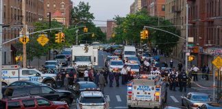 Penn Station Bloodbath Ignites NY Fury Police activity on a city street with emergency vehicles.