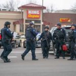 Police officers gathered outside King Soopers grocery store.