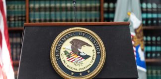 Podium with the Department of Justice seal and American flag in the background