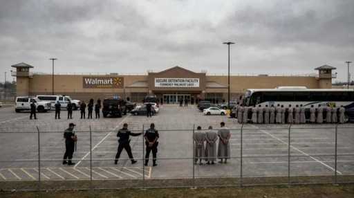 shutterstock_2717861769_edited.jpeg Law enforcement officers and detainees outside a secure detention facility at a Walmart location