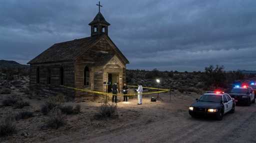 Police and forensic team at a crime scene near an abandoned church in the desert