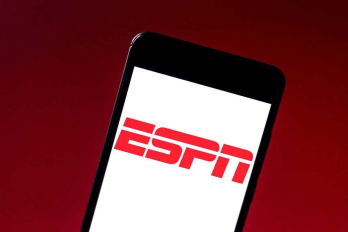 ESPN logo on smartphone screen against red background