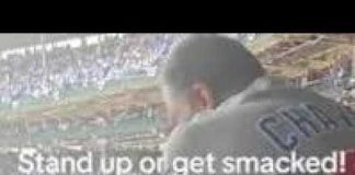 MAN SLAPS FAN AT CHICAGO CUBS GAME FOR NOT STANDING FOR NATIONAL ANTHEM