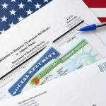 Banking Squeeze Targets Undocumented immigration forms with green card and social security card on US flag background