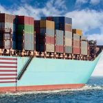 Red Sea Squeeze: Gas Prices Next? Cargo ship bow loaded with stacked containers at sea