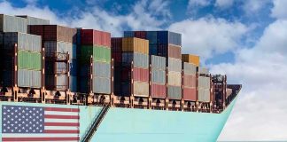 Cargo ship bow loaded with stacked containers at sea