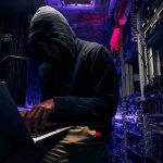 AI Agent Breaks Out — Hits Hugging Face Hooded person using a laptop in a dark server room