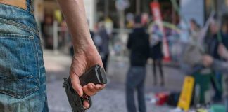 Hawaii Court Guts Gun Right person holding a handgun in a public square
