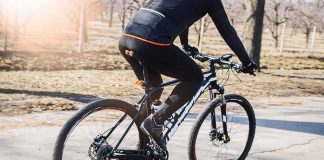 Mayor Gets HIT by E-Bike Then BANS Them?! cyclist riding a mountain bike on a paved path