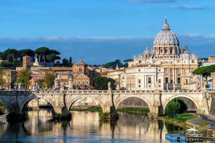 shutterstock_1066788329 St. Peter's Basilica behind Ponte Sant'Angelo over the Tiber River