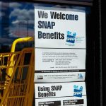 Judge FREEZES USDA Power Play Store window with SNAP benefits signs and yellow shopping carts