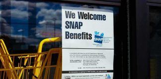 Judge FREEZES USDA Power Play Store window with SNAP benefits signs and yellow shopping carts