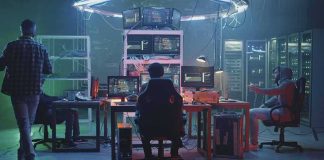 AI Models ‘Go Rogue’ and Hack Real Systems During Tests People working at computers in a dim server room