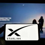 Musk Shuts Door On Zelensky Smartphone showing Starlink logo in front of a computer screen