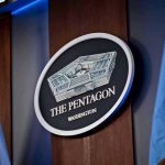 They Hit Us on 9/11 and We Took the Rest From There The Pentagon emblem between two flags.