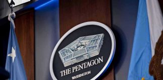 They Hit Us on 9/11 and We Took the Rest From There The Pentagon emblem between two flags.