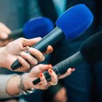 See What HATEFUL Radicals Did to Charlie Kirk’s Statue Reporters holding colorful microphones