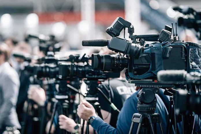 default-hero-02-3 Broadcast cameras on tripods at a press event