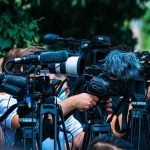 LIFE SAVING! Cancer Doctors Get a New AI Tool TV news cameras crowding together at an outdoor event