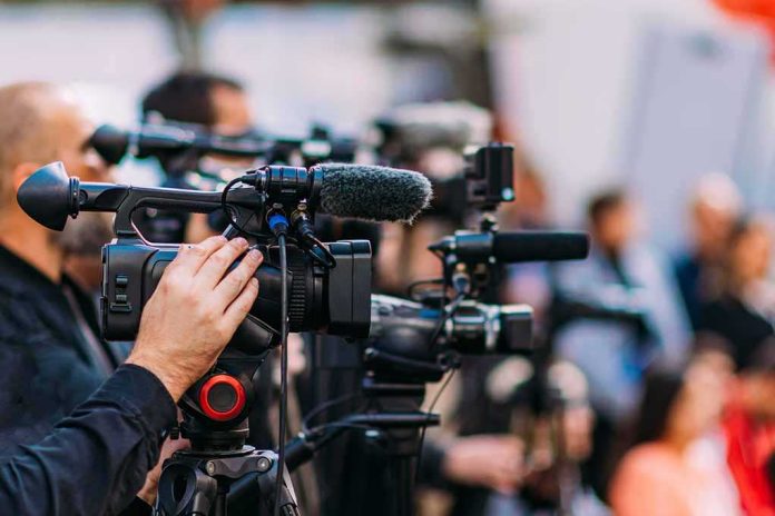 default-hero-04-1 Video cameras on tripods at a media event