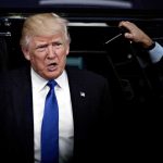 Former Senior Political Advisor Sees a Trump Problem Coming Donald Trump stepping out of a vehicle in a suit and blue tie