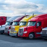 Robbery Tip-Off Exposes Trucking’s Soft Underbelly Row of colorful semi-trucks parked in a lot