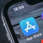 Apple Hit With Massive Claim smartphone screen showing app icons and notification badges