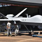 Fishermen Catch Military Drone Military drone being serviced by ground crew outside a hangar