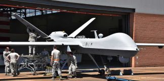 Fishermen Catch Military Drone Military drone being serviced by ground crew outside a hangar