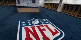 NFL Orders Player to Remove THIS Message NFL logo on the floor of an empty locker room
