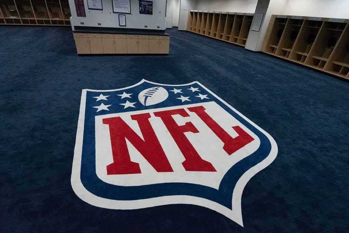 shutterstock_1163596087-1 NFL logo on the floor of an empty locker room