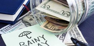 Rainy day savings jar spilling cash and note