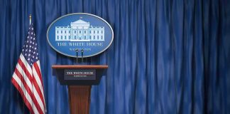 TRUMP Responds to Questions About CNN, MSNOW Political Ban White House press briefing podium with U.S. flag and blue curtain