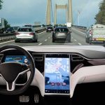 Self-driving car interior on a busy bridge highway