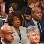 FCC Puts The View On Trial Maxine Waters seated among attendees at an indoor event
