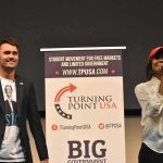 Donald Trump Jr. Makes a Promise to Charlie Kirk Curro Savoy at a TPUSA event with another speaker on stage