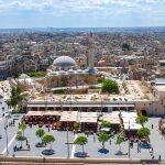 Deadly Mosque Attack Exposes Online Hate’s Real-World Danger historic mosque with domes and minaret overlooking a busy city square