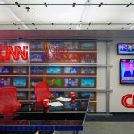 Trump Just Officially CRUSHED CNN and MSNBC! CNN newsroom set with red chairs and multiple TVs