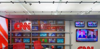 Trump Just Officially CRUSHED CNN and MSNBC! CNN newsroom set with red chairs and multiple TVs