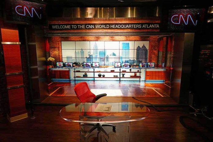 shutterstock_1284301786 CNN studio set with empty anchor desk and red chair