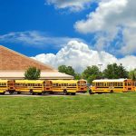 Texas Schools Bus Students to Mosque to ‘Experience Islam’ A row of yellow school buses parked in front of a school building under a cloudy sky