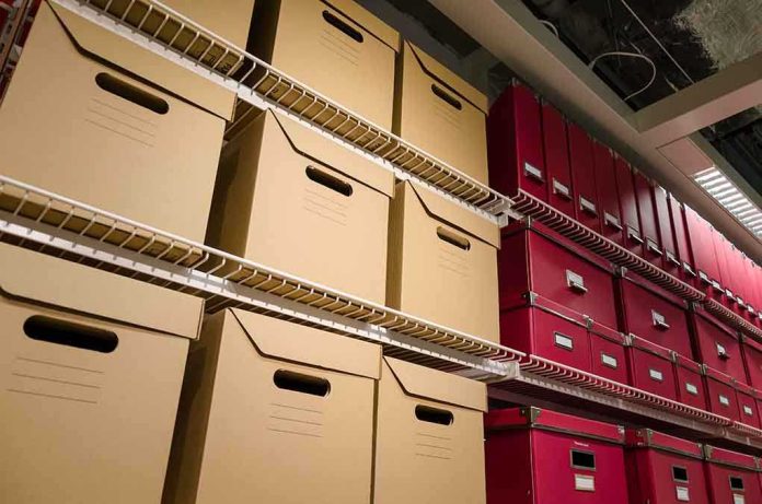shutterstock_133401359 Shelves filled with brown and red storage boxes for organizing documents