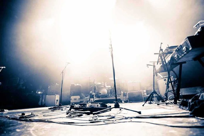 shutterstock_140154739 Empty concert stage with instruments and bright lights